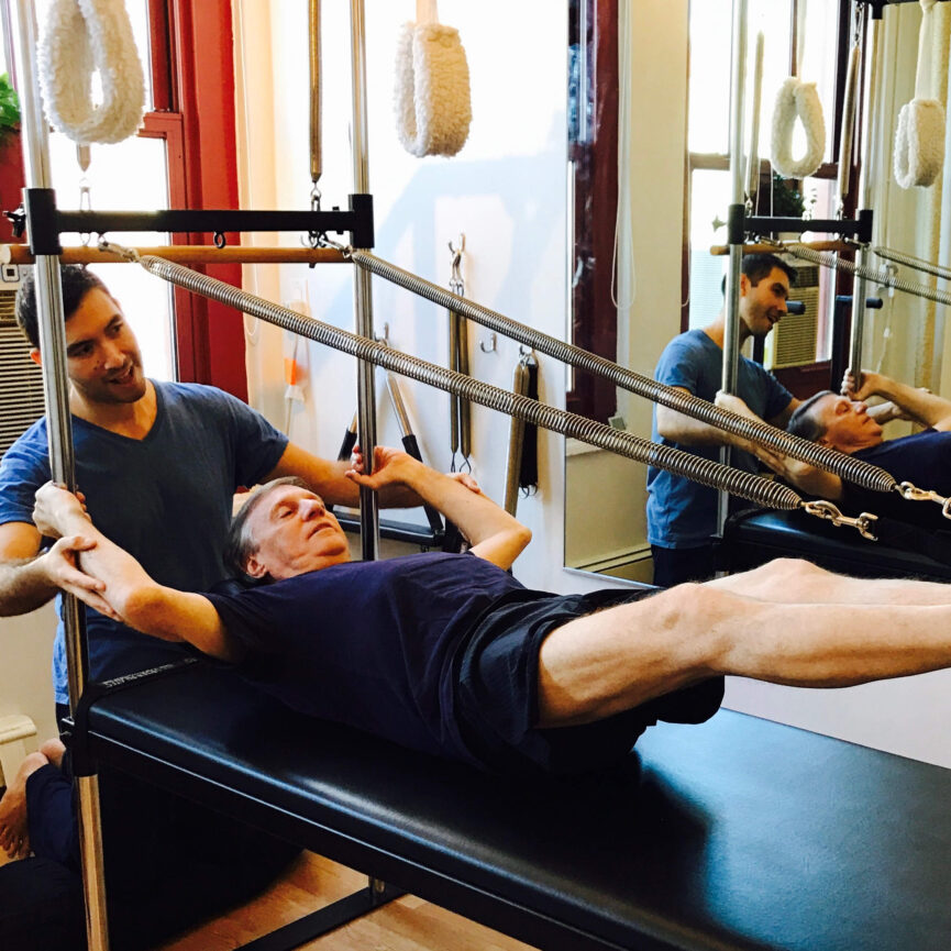 Man practicing Pilates for Strength