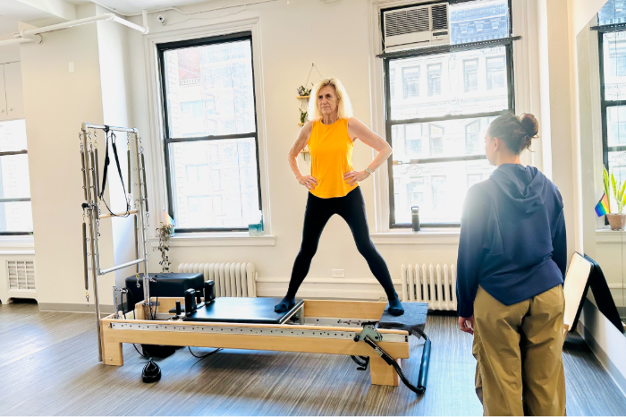 Pat in a session with a comprehensively certified practitioner at Dynamic Body Pilates