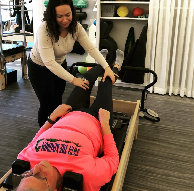 Rebecca working with a client at Dynamic Body Pilates