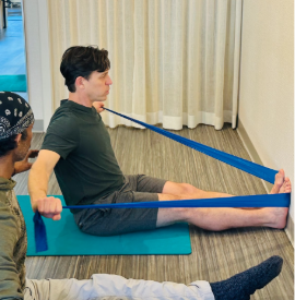 Scott Fava works with Pilates bands to increase strength.