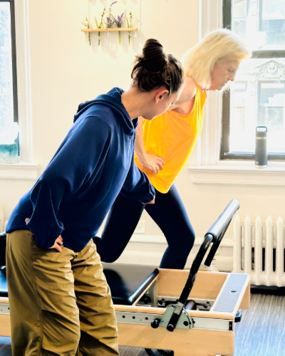 A DBP practitioner guides Pat in exercises to address hip joint pain from aging.